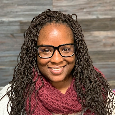 Neuropathy Doctor Sheryona Green-Owusu Smiling In Red Scarf