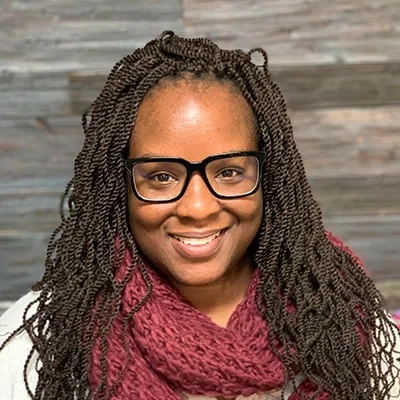 Chiropractor Sheryona Green-Owusu Smiling In Red Scarf
